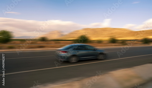Obraz na płótnie Blurred Car Speeding Along a Scenic Road in Turkey w salonie