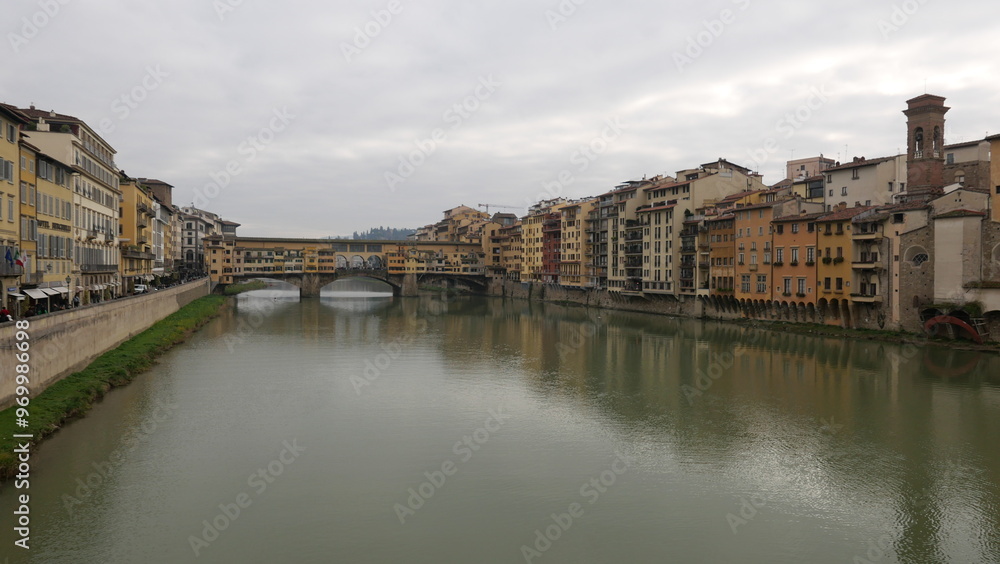 Florence, Italy - decembre 27 2024: Sunny Tuscany with iconic Ponte Vecchio, Florence skyline historic architecture, Arno River reflections. A colorful blend of Renaissance culture, medieval landmarks Florence, Italy - decembre 27 2024: Sunny Tuscany with iconic Ponte Vecchio, Florence skyline historic architecture, Arno River reflections. A colorful blend of Renaissance culture, medieval landmarks