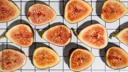 figs on a white and black grid background with hard shadows
