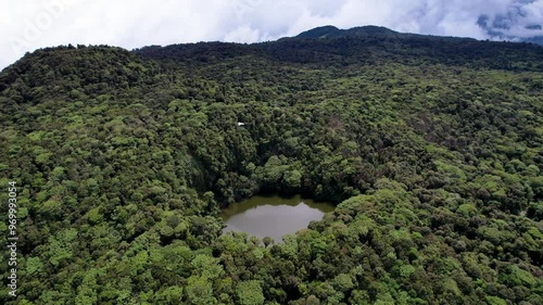 Beautiful cinematic aerial view of the Barva Volcano in the Braulio Carrillo National Park, its dens rain forest  in Costa Rica