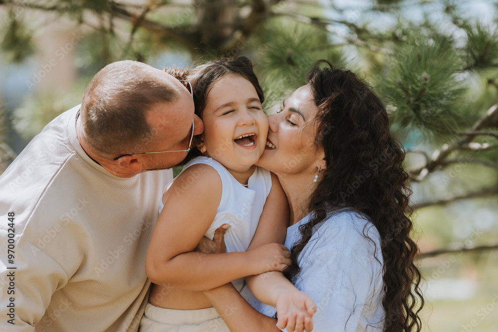 Fototapeta premium happy family is relaxing in the city park