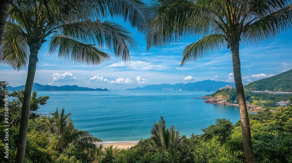 Palm trees frame a scenic view of the South China Sea coastline in Sanya, China, at Park World's End.