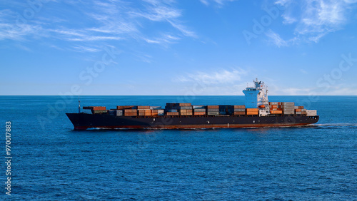 International commerce container cargo ship delivering freight shipment across the ocean.