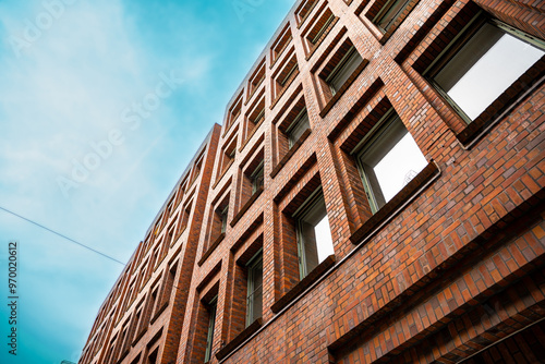 Low Angle View of Modern Red Brick Building Against Blue Sky