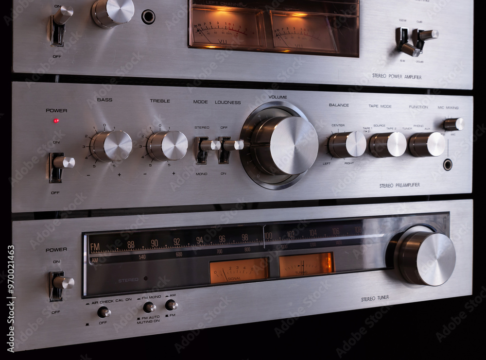 Fototapeta premium Vintage Audio Stereo Gear Separate Components System Setup, Tuner, pre-Amplifier, Power Amplifier. Metal Front Panel, Angled View Closeup