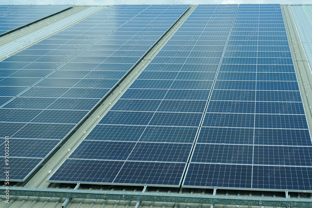 the rooftop of factory warehouse. renewable energy of photovoltaic for reduce energy and carbon footprint. clean energy.solar panels producing clean green renewable energy of factory warehouse.