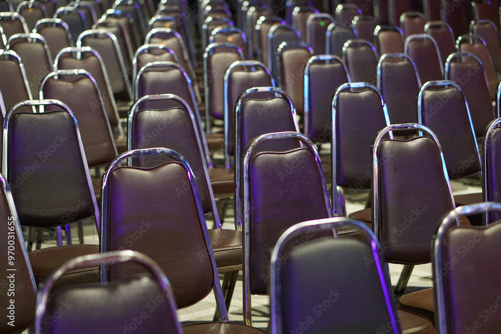Fototapeta premium The atmosphere of a large conference room with rows of chairs.