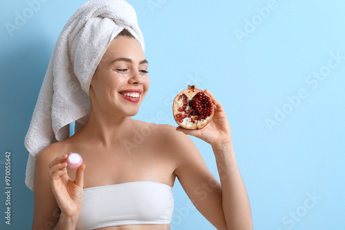 Young woman with pomegranat...