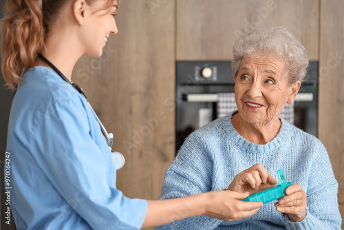 Senior woman with doctor ta...