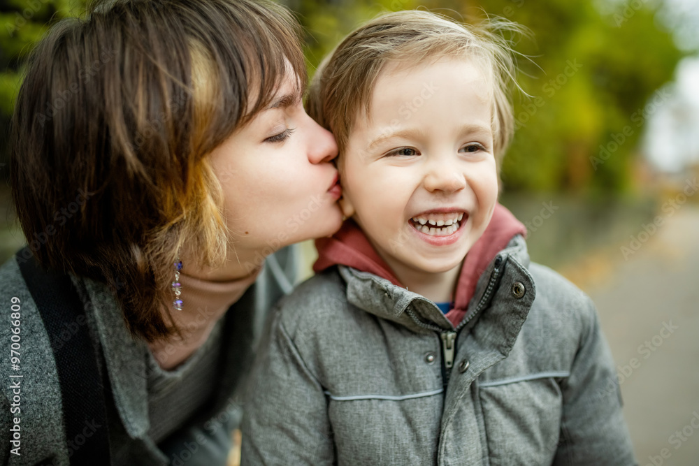 Teenage sister and her little brother having fun outdoors. Young girls with a toddler boy on autumn day. Teenage sister and her little brother having fun outdoors. Young girls with a toddler boy on autumn day.
