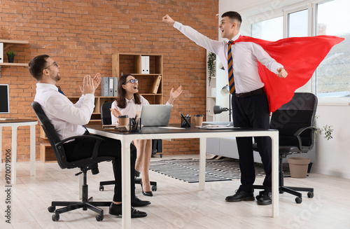 Businessman dressed as supe...