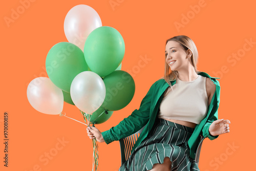Young woman with balloons s...