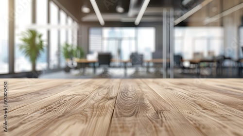 Wallpaper Mural A modern office interior with a wooden table in the foreground, featuring greenery and a bright, professional atmosphere. Torontodigital.ca