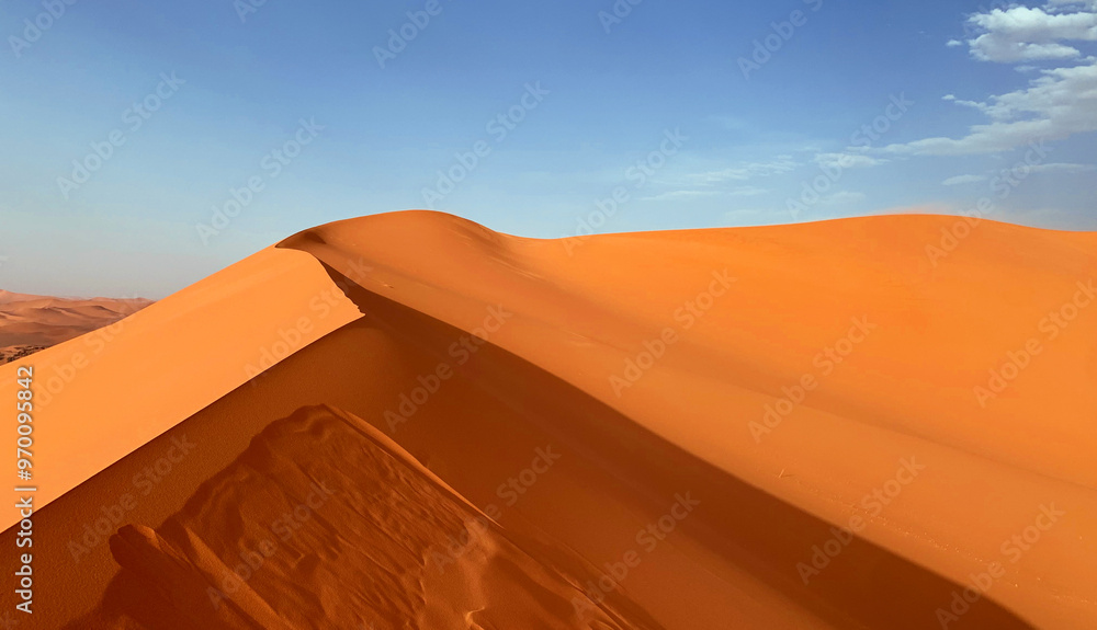 Sand dunes in the Sahara desert, dune edge, Algerian part of the Sahara in the Tadrart and Tassili n'Ajjer mountains Sand dunes in the Sahara desert, dune edge, Algerian part of the Sahara in the Tadrart and Tassili n'Ajjer mountains