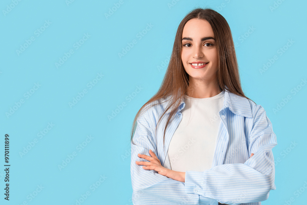 Young beautiful woman on blue background Young beautiful woman on blue background