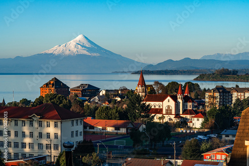 Skyline of the city of Puerto Varas on a clear and sunny winter day, with the Osorno volcano by Lake Llanquihue, Chilean Patagonia. photo