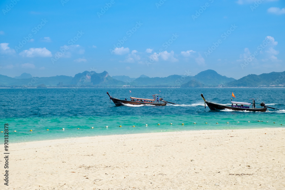 Long tail boat on the tropical beach in thailand Long tail boat on the tropical beach in thailand