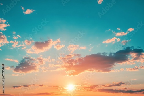 A captivating image of a sunrise illuminating the sky with golden hues and scattered clouds, creating a vibrant and stunning visual effect. photo