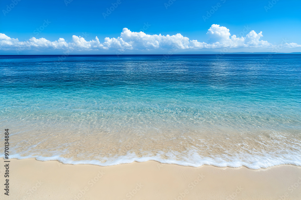 A serene beach scene with clear blue water, white sandy beach and a bright blue sky. A serene beach scene with clear blue water, white sandy beach and a bright blue sky.