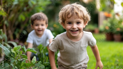 Two cheerful young boys with smiles on their faces enjoy playing and exploring together in a lush green garden, showcasing the joy of childhood and nature.