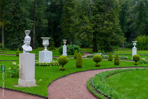 Genre sculptures and vases along the paths near the Chinese Palace in Oranienbaum Park, Lomonosov, Russia 