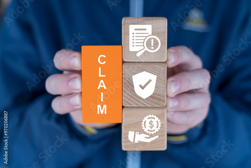 Slika na platnu Man holding blocks with icons and text sees word: CLAIM