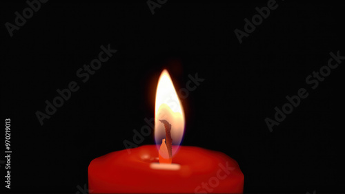 Halloween red candle with a glowing flame in the dark