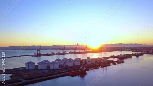 Wallpaper Mural Sunset, harbour and ocean with drone, travel and landscape with calm morning, summer holiday and nature. Seaside, environment and sunrise with a boat, natural and ship with vacation, break and luxury Torontodigital.ca