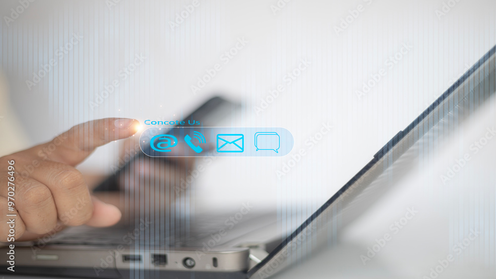 Contact us or Customer support hotline people connect. Businessman using a laptop with virtual screen contact icons Contact us or Customer support hotline people connect. Businessman using a laptop with virtual screen contact icons