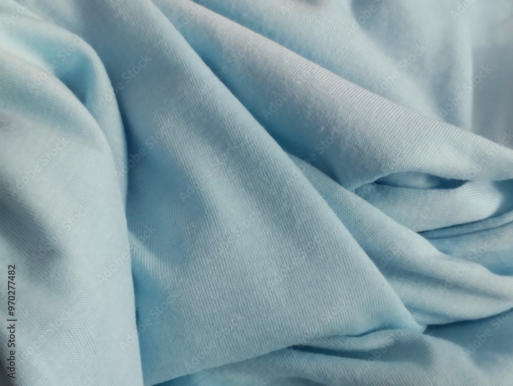 Fototapeta premium abstract wavy background blurred from blue fabric