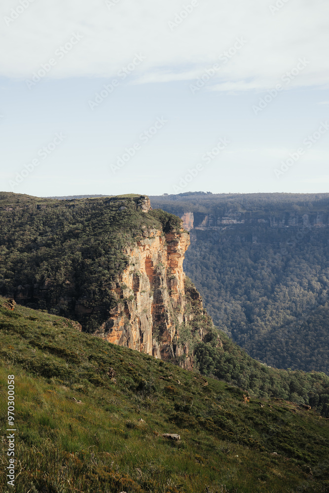 Naklejka premium Overlooking a waterfall in a mountain range