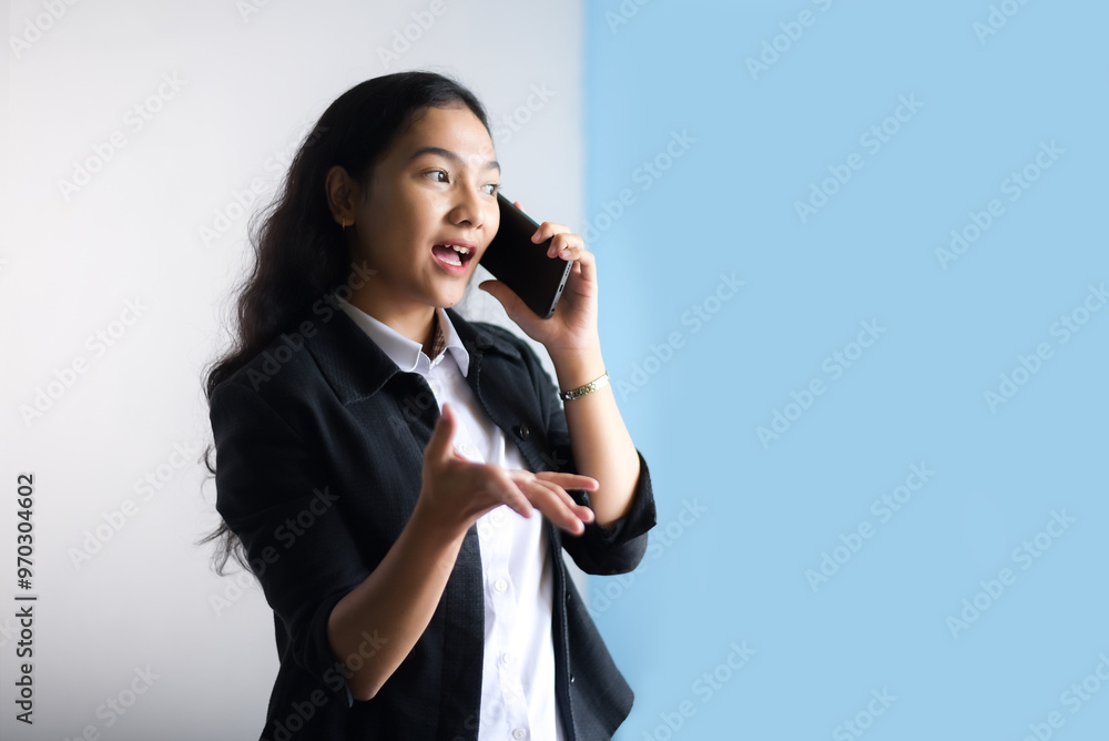 Female entrepreneur talking on the phone asking for help to fix her damaged laptop, isolated on white background. A young businesswoman using a cell phone. Female entrepreneur talking on the phone asking for help to fix her damaged laptop, isolated on white background. A young businesswoman using a cell phone.