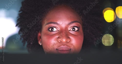 Night, computer and woman or hacker looking around with sneaky eyes, cybersecurity or fraud in office bokeh. African worker in fear, scared or suspicious for hacking mistake, system or online crime