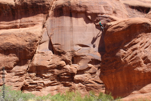Person repels down red rocks