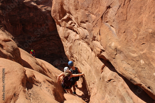 Rappelling down red rock canyon  photo