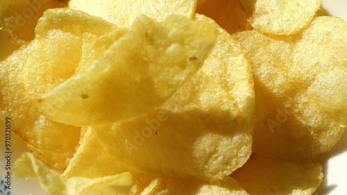 slow motion of potato chips dropping in a plate  photo