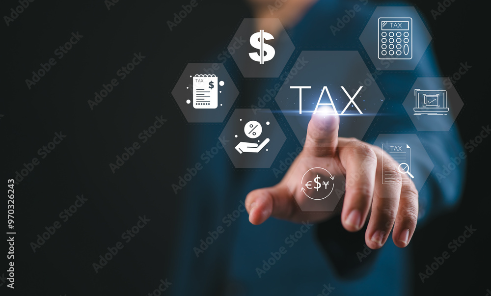 Business hand clicks virtual screen to tax return online for tax payment by corporations such as VAT, income tax, and property tax. Business hand clicks virtual screen to tax return online for tax payment by corporations such as VAT, income tax, and property tax.