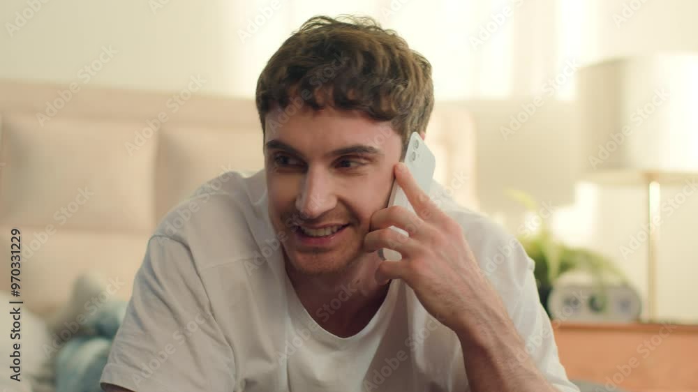 Caucasian European man lying on bed bedroom talking mobile phone smartphone cellphone technology gadget call communication guy male conversation chatting connect friendship dialogue digital speaking Caucasian European man lying on bed bedroom talking mobile phone smartphone cellphone technology gadget call communication guy male conversation chatting connect friendship dialogue digital speaking