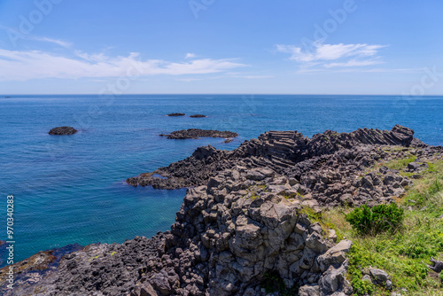 Volcanic sea rocks with the background of horizon and blue sky at Yangnam Columnar Joints near Gyeongju-si, South Korea 