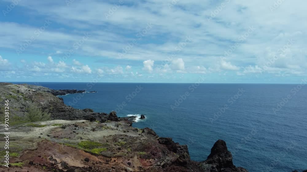 The drone's aerial perspective of West Maui, Hawaii, showcases its dramatic cliffs, vibrant greenery, and the vast expanse of the ocean, offering a serene and awe-inspiring view of the island.