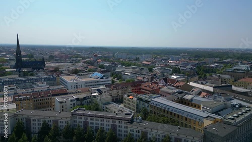 Wallpaper Mural leipzig new city hall, a stunning example of german renaissance architecture, surrounded by the bustling city on a bright summer day. Fantastic aerial view flight rotation to right drone Torontodigital.ca