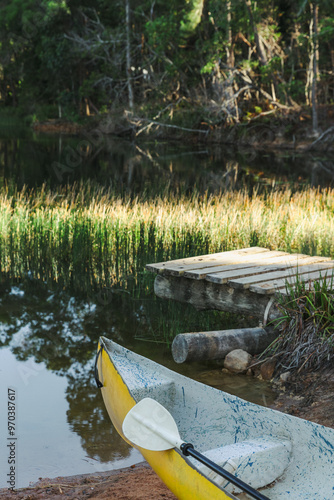 Yellow canoe in front of a wharf