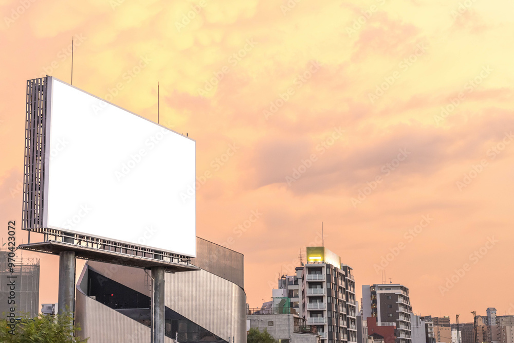 Blank empty advertisement billboard in city with pastel sunset sky background, copy space Blank empty advertisement billboard in city with pastel sunset sky background, copy space