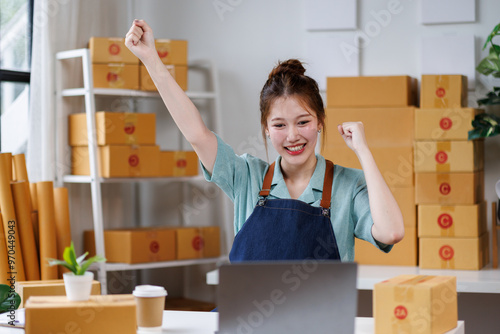 Obraz na plátně Excited happy, Attractive young asian chinese SME owners woman entrepreneurs working on receipt box and check online orders, SME home business ideas online