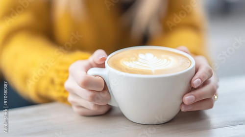 person holding a cup of latte