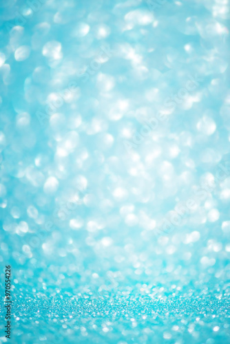 Defocus light background blue with white. Blurred glitters, sparkles shine, bokeh.