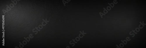 a dark, textured surface with a subtle gradient effect, resembling a black leather or vinyl material.