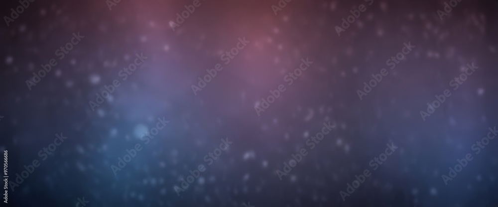 Obraz premium The image is a blurred, abstract representation of a starry night sky, with a gradient of purple and blue tones.
