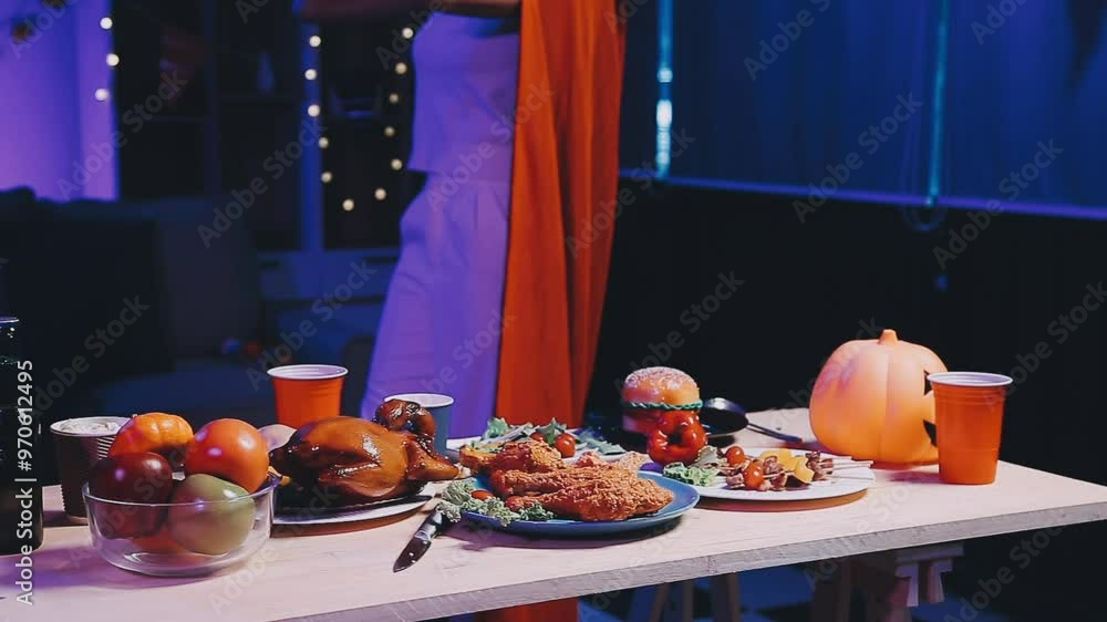 Four people dancing at a costume Halloween party in a house. Four people dancing at a costume Halloween party in a house.