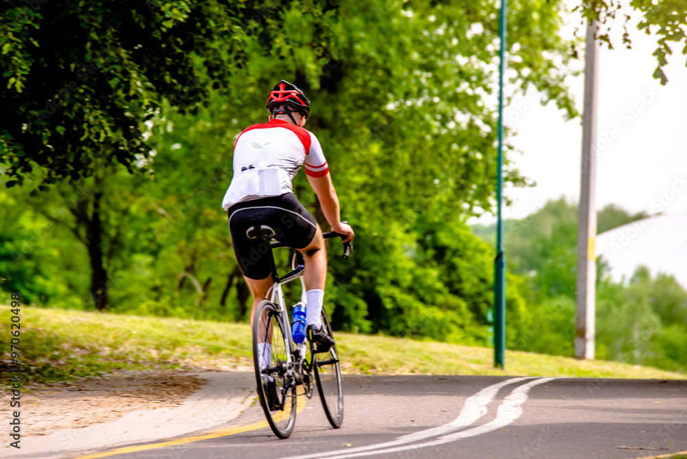 Cyclist ride on the bike path in the city Park
Cyclist ride on the bike path in the city Park